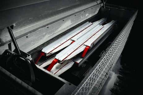 Two ramps folded up in a toolbox. 工具箱里折叠着两个斜坡。