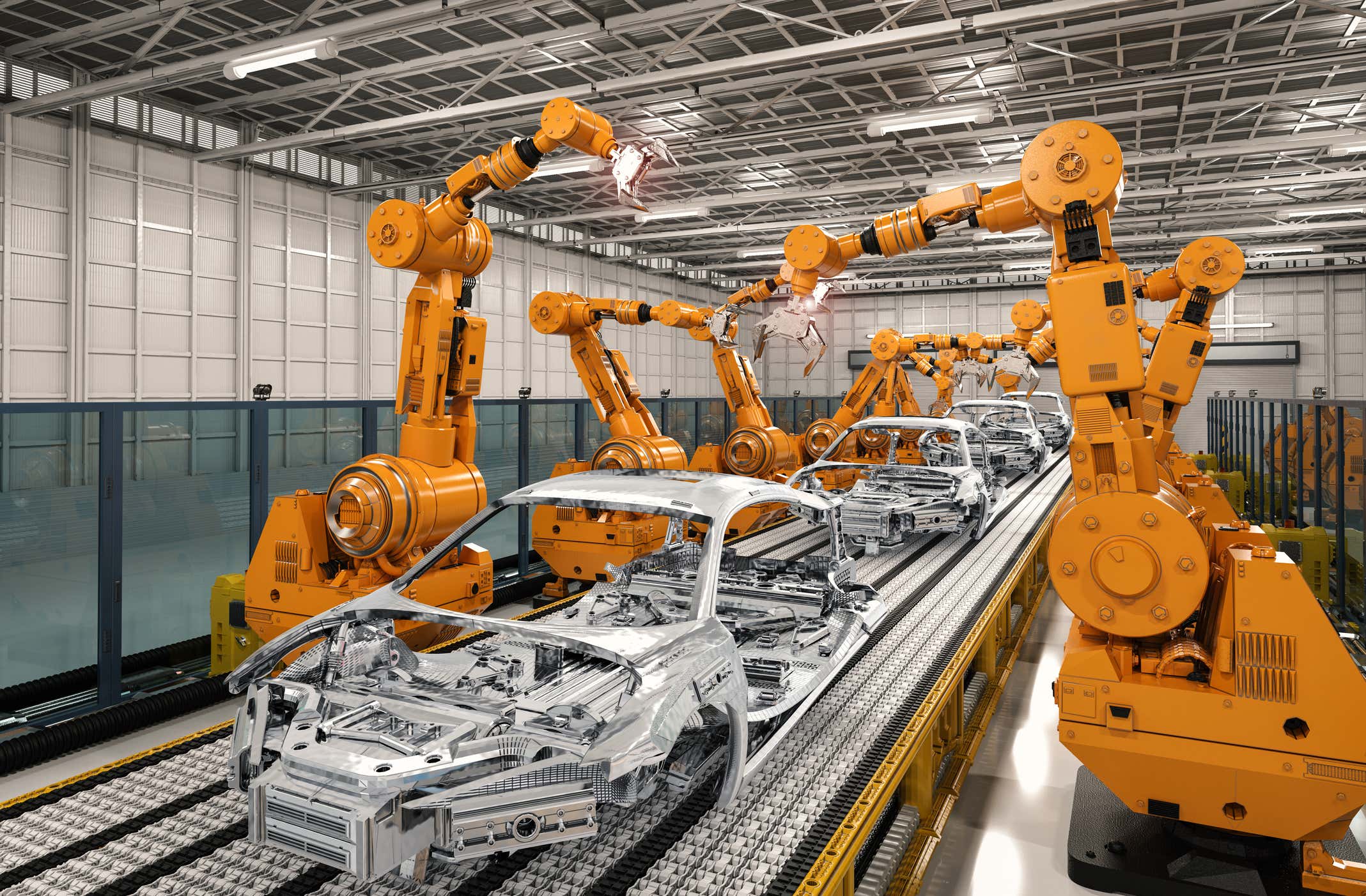 A factory line of cars under construction. 建设中的汽车工厂线。