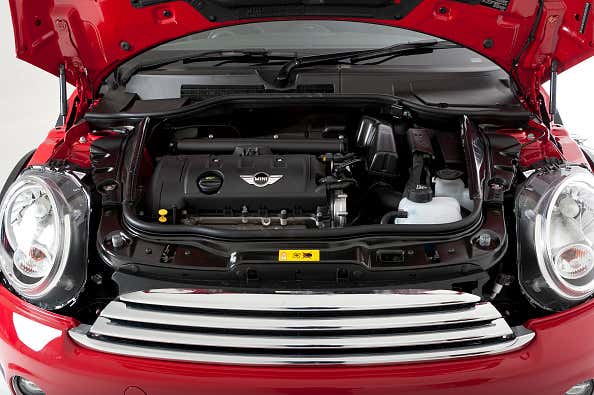 A 2012 Mini Coupe Cooper with the hood open 一辆开着引擎盖的2012款Mini Coupe Cooper