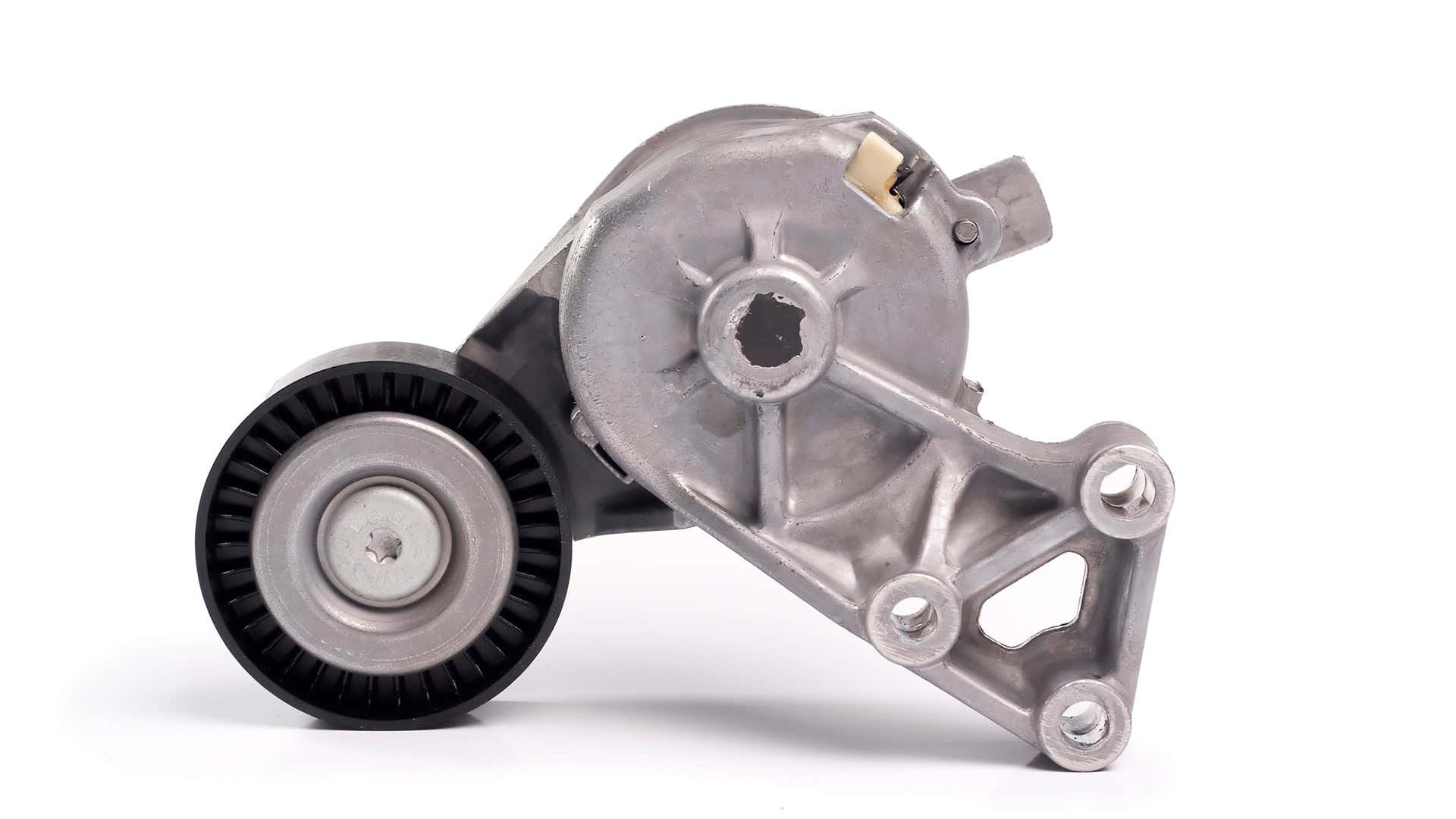 A belt tensioner off the engine on a white background. 白色背景上的发动机皮带张紧器。